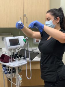 picture of haven elite staff member disinfecting medical equipment